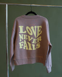 Hazy Pink Love Never Fails Crewneck (Women's Cut)